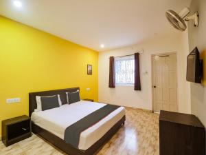 Ένα ή περισσότερα κρεβάτια σε δωμάτιο στο Hotel O MAP INN