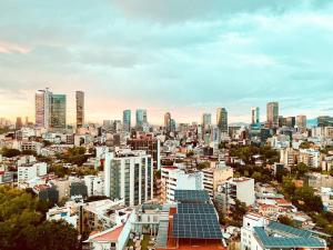 a view of a city with tall buildings at Suite Chic HCondesa in Mexico City