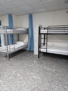 Postel nebo postele na pokoji v ubytování Hoomy Hostel