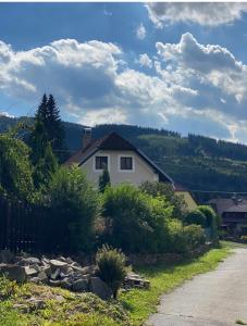 a house on the side of a road at Pohorsko-chata in Pohorsko