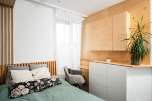 Posteľ alebo postele v izbe v ubytovaní NovaNest Apartments - Kalwaryjska - by Upstairs