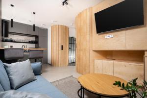 Televízia a/alebo spoločenská miestnosť v ubytovaní NovaNest Apartments - Kalwaryjska - by Upstairs