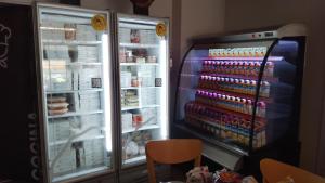 a refrigerator with its door open with food inside at B&B Unique in Salta