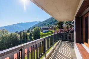 a balcony with a view of the mountains at Arnica 1 - 6 pers - piscine in Nendaz