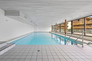 a large swimming pool in a building at Eden Roc 6 - 4 pers - pres des pistes in Nendaz