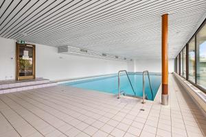 a swimming pool inside of a building with a swimming pool at Eden Roc 6 - 4 pers - pres des pistes in Nendaz