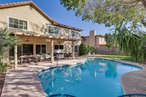 a swimming pool in front of a house at Stunning Tempe Home with Pool - Near ASU Campus! in Tempe