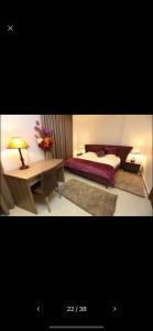 Postel nebo postele na pokoji v ubytování Delora Hotel and Suites