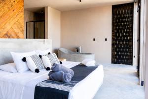 Postel nebo postele na pokoji v ubytování Hotel Macondo Estilo Holbox