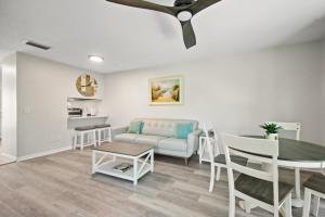 a living room with a couch and a table at 2 Bed/2 Bath Beach Condo in St. Augustine