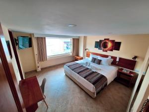 Postel nebo postele na pokoji v ubytování Hotel Estación Sabana
