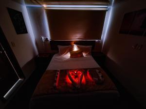 Postel nebo postele na pokoji v ubytování Hotel Estación Sabana