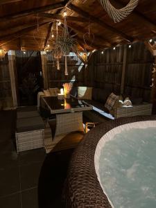 a room with a jacuzzi tub in a house at Barn with Hot Tub in Goffs Oak