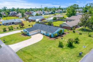 an aerial view of a home in a residential neighborhood at Cozy 3 Bedroom Home in Lake Charles
