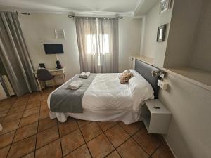 Posteľ alebo postele v izbe v ubytovaní Hostal La Campana