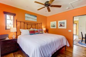 a bedroom with a bed and a ceiling fan at West Beach Villa 6 in Santa Barbara