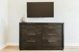 a dresser with a television on top of it at Villa Castillo 2 in Santa Barbara