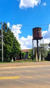 a water tower sitting on the side of a street at Snow Valley Eco Lodge in São Joaquim