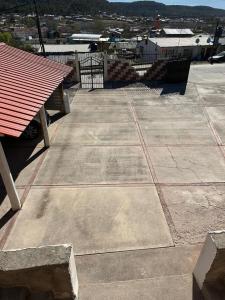 a picnic table and a bench in a parking lot at The valley in Creel +3 photos