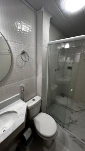 Een badkamer bij Pousada Alfa