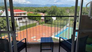 a view of a tennis court from a balcony at Apartamento Girardot Peñalisa con Piscina in Ricaurte