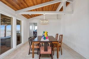 a dining room with a table and chairs at 3 Bedroom House on the Lake in Lake Charles
