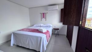 Cama ou camas em um quarto em Pousada Estrelar