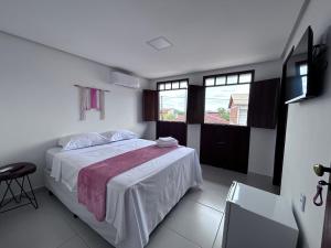 Cama ou camas em um quarto em Pousada Estrelar