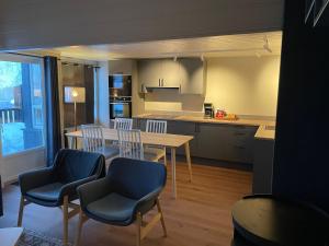 a kitchen and dining room with a table and chairs at Trysil Alpin 16A Top location in Trysil