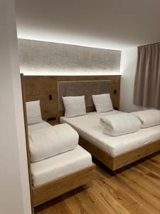 Łóżko lub łóżka w pokoju w obiekcie Ferienwohnung Krallinger