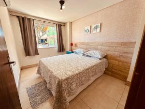 Postel nebo postele na pokoji v ubytování Vila Madu