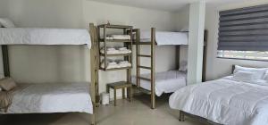Letto o letti in una camera di Hotel Ocean Fusagasuga