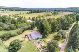 an aerial view of a house in the middle of a field at Farm House in Coldwater