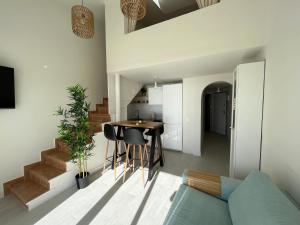 a living room with a table and a couch at BLUE HORIZON Morro Jable in Morro del Jable