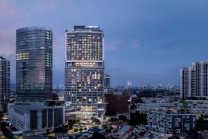 a city skyline with two tall skyscrapers at Le Meridien Petaling Jaya in Petaling Jaya