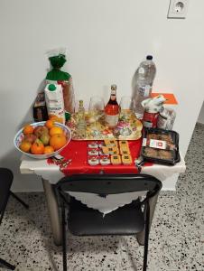 a table filled with food and a bowl of fruit at Ξενώνας museum ισόγειο στο Ελληνικό Ιωαννίνων in Kalentzi