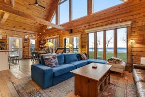 a living room with a blue couch and a table at Sunset Hideaway in Isle la Motte