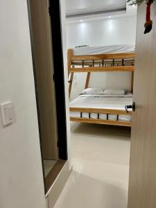 Letto o letti in una camera di HOTEL TORRE DELUXE ¨SANTORINI¨