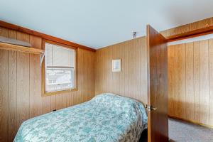 Seaglass Cottage tesisinde bir odada yatak veya yataklar