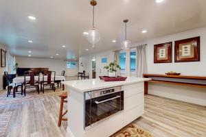 a kitchen and living room with a dining room at The Lake's Hidden Gem in Snoqualmie