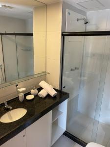 a bathroom with a sink and a shower at Makia Beach Experience - Flat 16A - TÉRREO - SOFT OPENING in Porto De Galinhas