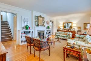 a living room with a couch and a fireplace at Charming and Spacious Olean Home with 2 Fireplaces in Olean