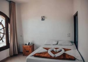 Postel nebo postele na pokoji v ubytování DownTown Hotel