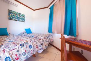 Łóżko lub łóżka w pokoju w obiekcie Hotel Los Corales
