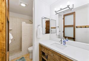 a bathroom with a sink and a toilet at Brooks Beach Vacations Cottage G5 Oceanside in Oceanside