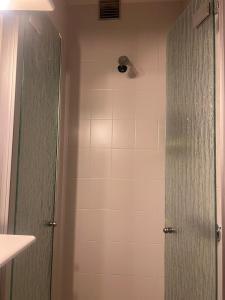 a bathroom with a shower with a glass door at Artesina sulle piste in Sella della Turra