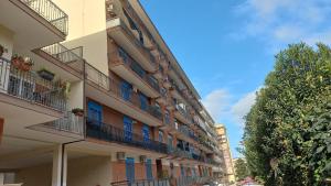 an apartment building with balconies on a street at OASI CL in Bari