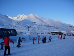 a group of people skiing on a ski slope at Hotel Stella in Passo del Tonale