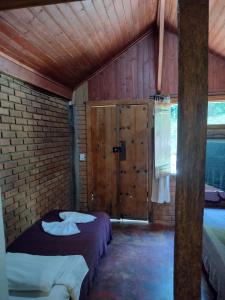 Postel nebo postele na pokoji v ubytování Pousada Toque de Minas