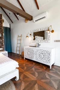 a bathroom with a white vanity and a mirror at Golden Beach Resort in Koh Rong Island